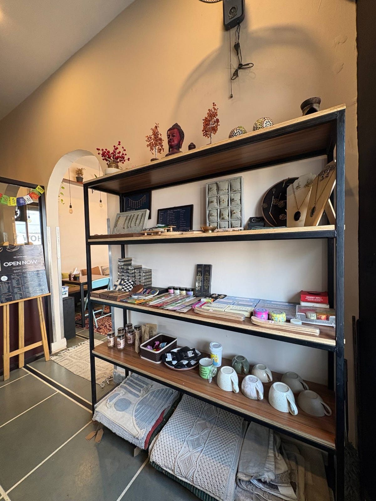 Curated shelf of goods and decor inside One Coffee Down