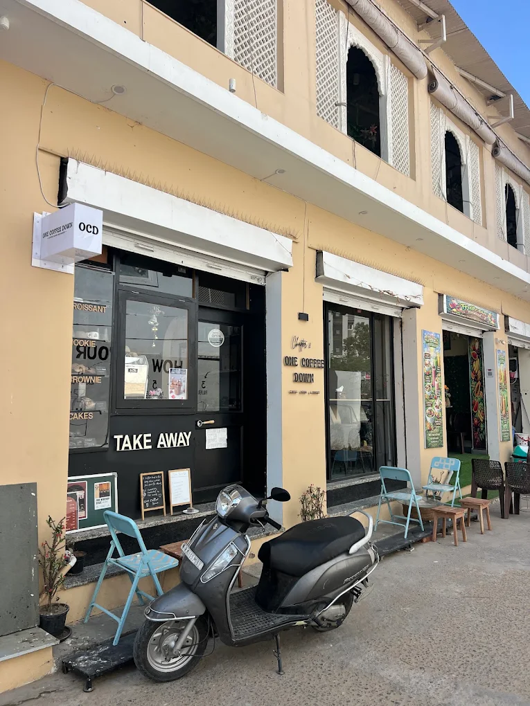 One Coffee Down storefront and take-away counter on Sunset Road
