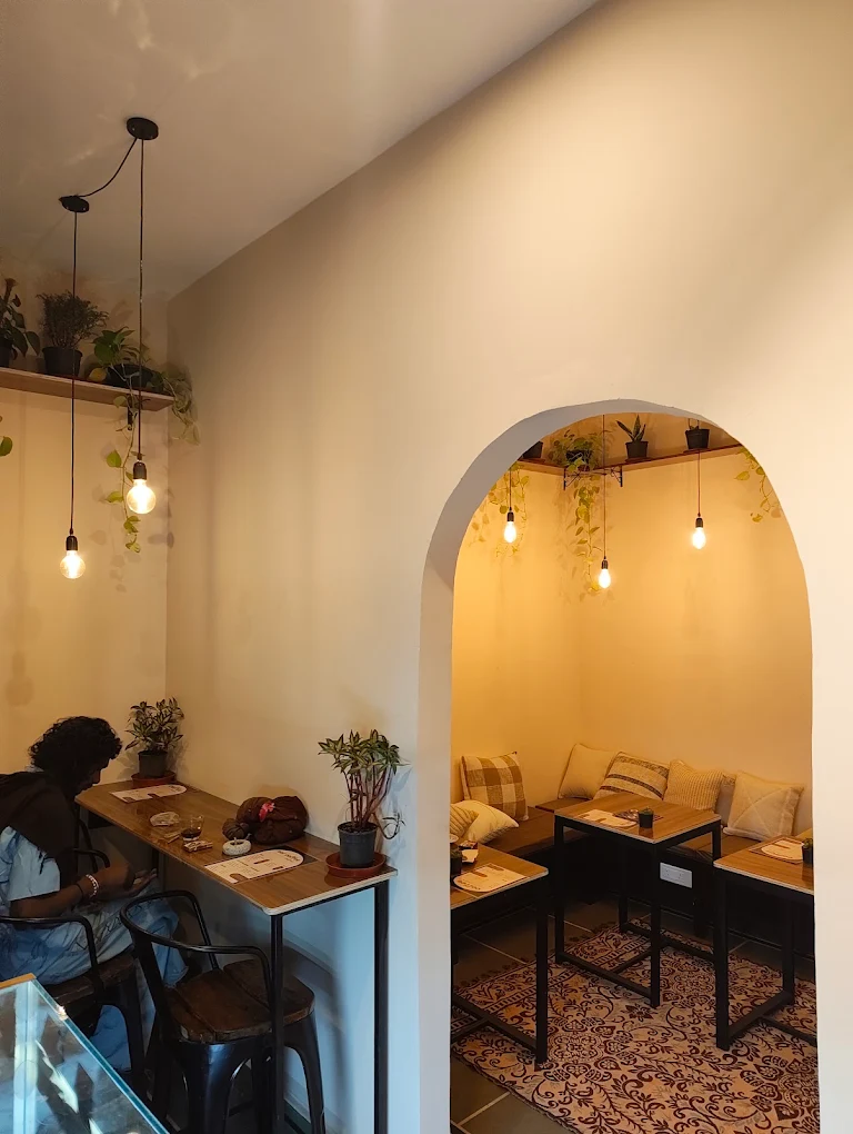 Cozy archway seating nook with pendant lights